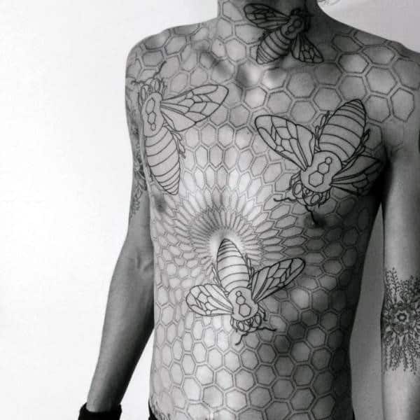 Man With Gigantic Bees And Hexagonal Honeycomb Tattoo On Torso