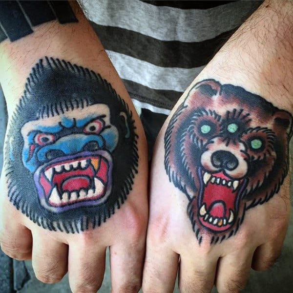 Man With Gorilla And Bear Tattoos On Hands