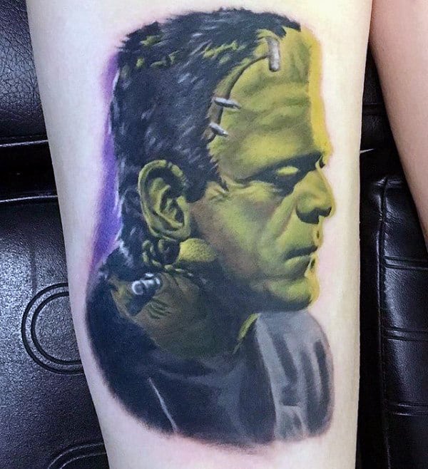 Man With Green Frankenstein Thigh Tattoo