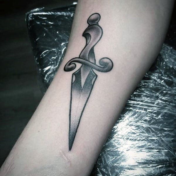 Man With Grey Dagger Tattoo On Forearms