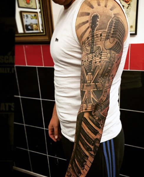 Man With Guitar Music Note Tattoo