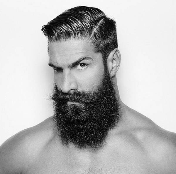 Man With Hard Part Hairstyle And Thick Beard