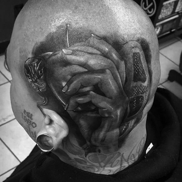 Man With Head Tattoo Of Hand Holding Apple And Snake