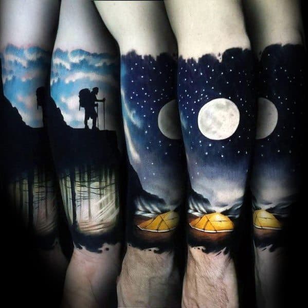Stunning full-sleeve tattoo featuring a hiker, starry night sky, full moon, and glowing tents, capturing the essence of outdoor adventure.