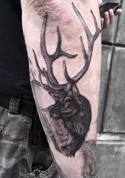 Man With Hunting Tattoo On Arm