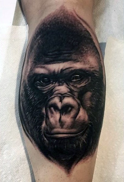 Man With Incredible Black Ink Gorilla On Back Of Leg Calf