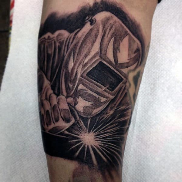 Man With Inner Arm Welder Tattoo