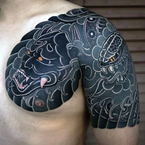 Man With Japanese Demon Mask Chest And Quarter Sleeve Tattoo