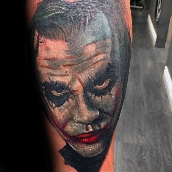 Man With Joker Face Tattoo On Arm