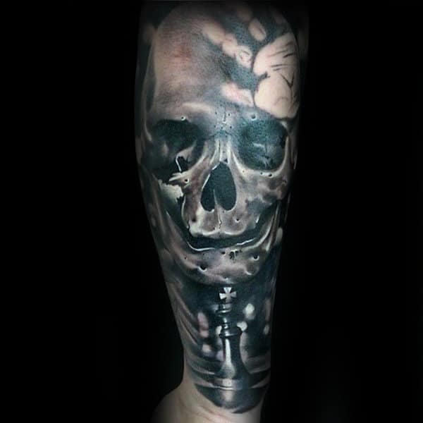 Man With King Chess Piece And Skull Forearm Sleeve Tattoo Design