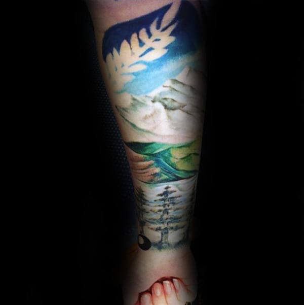 Man With Landscape Forearm Watercolor Sleeve Tattoo