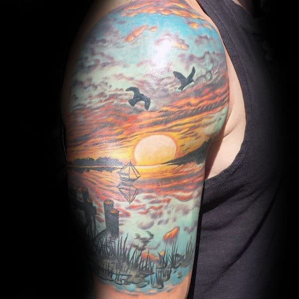 Man With Landscape Of Beach Tattoo Half Sleeve Design