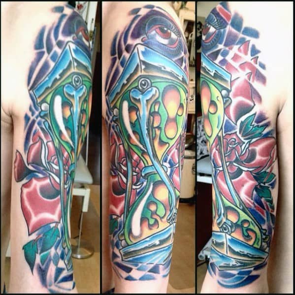 Colorful hourglass-inspired lava lamp tattoo with vivid wax and floral details, perfect for artistic men's tattoo inspiration.