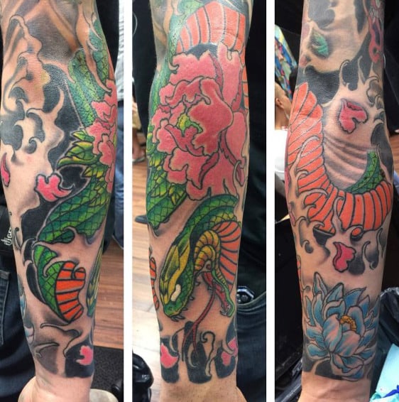 Man With Lotus Flower Snake Sleeve Tattoo