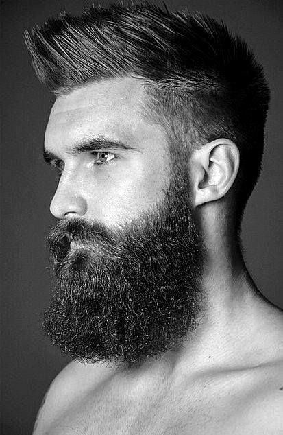 Man With Low Fade Faux Hawk Hairstyle And Beard
