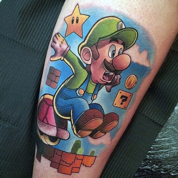 Vibrant tattoo of Luigi mid-jump on a Koopa shell, surrounded by Super Mario elements like a Super Star, coins, and question blocks.