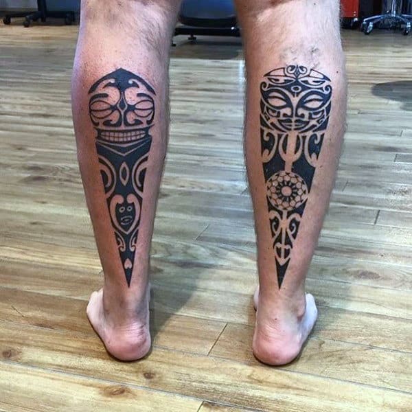 Man With Maori Tattoos On Back Of Legs