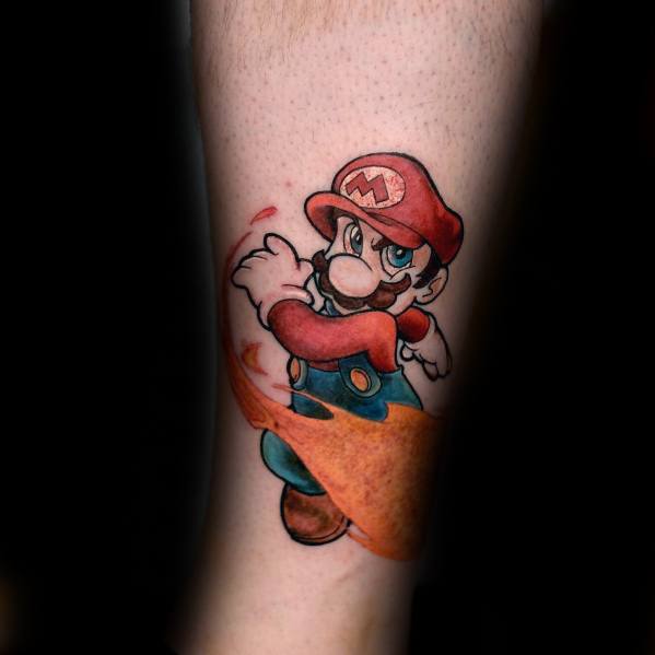 Dynamic *Super Mario* tattoo featuring Mario in action, throwing a fireball with bold colors and smooth shading for a powerful gaming-inspired design.