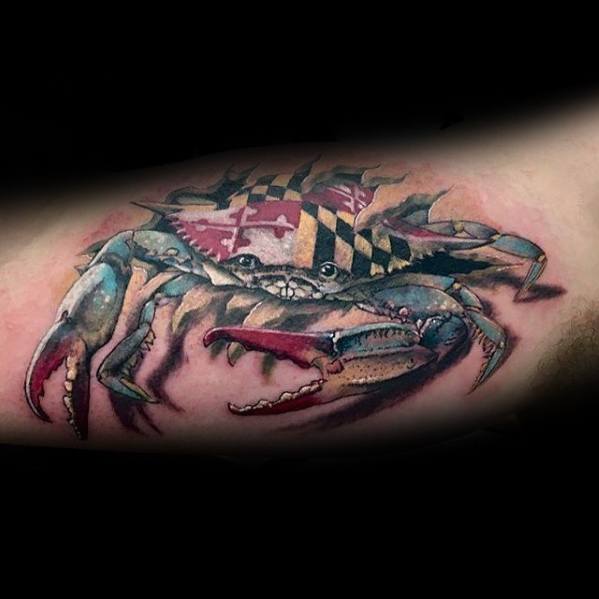 Realistic blue crab tattoo with a Maryland flag shell, symbolizing state pride and coastal heritage with detailed shading and vibrant colors.