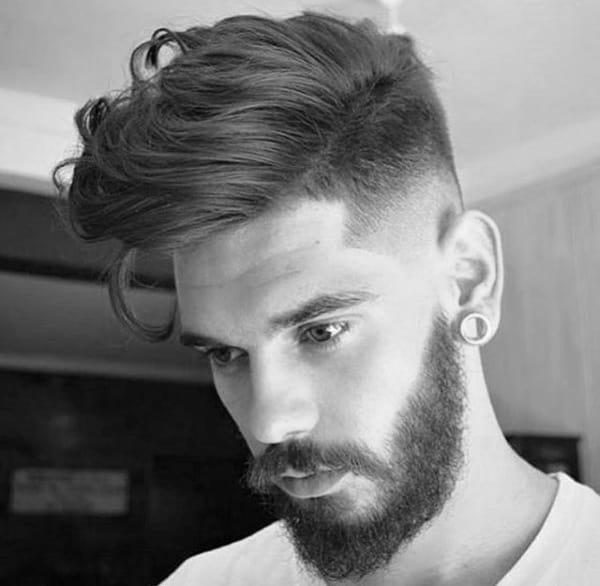 Man With Medium Hair Style Wavy And Beard