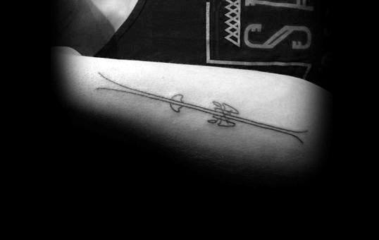 Man With Minimalist Skiing Outer Forearm Tattoo Design