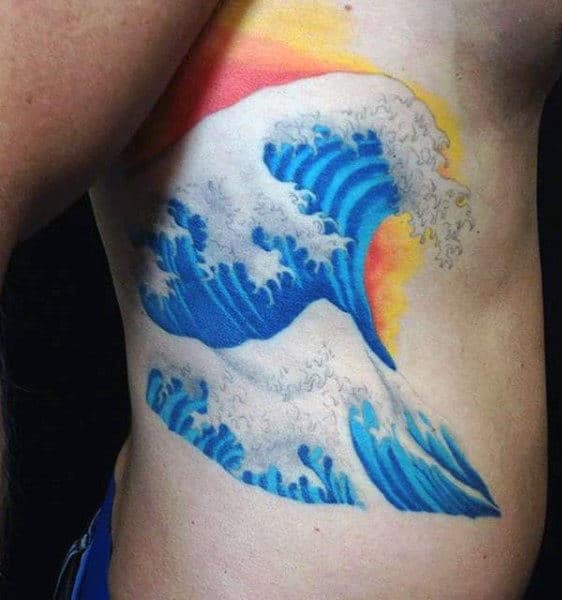 Man With Modern Style Wave And Sunset Tattoo On Side