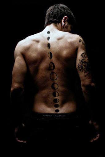 Man With Moon Phases Spine Tattoo