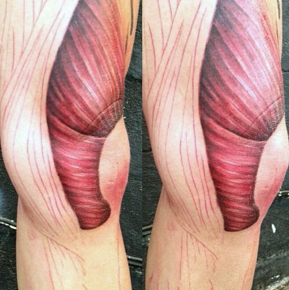 Man With Muscle Thigh Tattoo