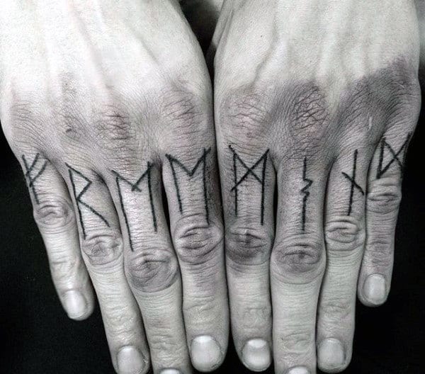 Man With Norse Rune Knuckle Tattoos