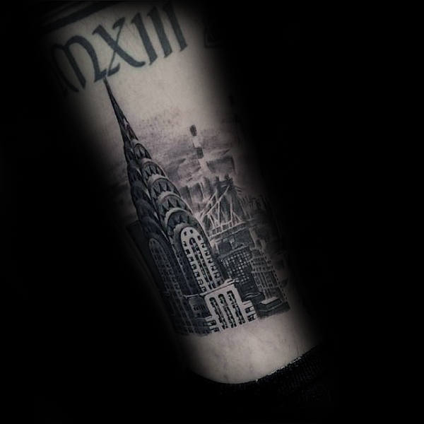 Man With Nyc Building Tattoo On Lower Leg