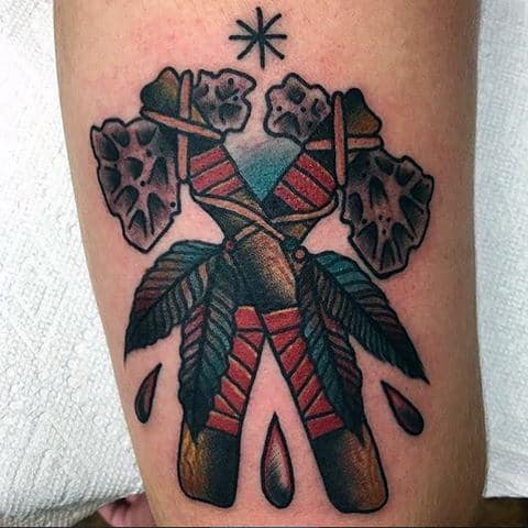 Man With Old School Tomahawk And Green Leaves Tattoo