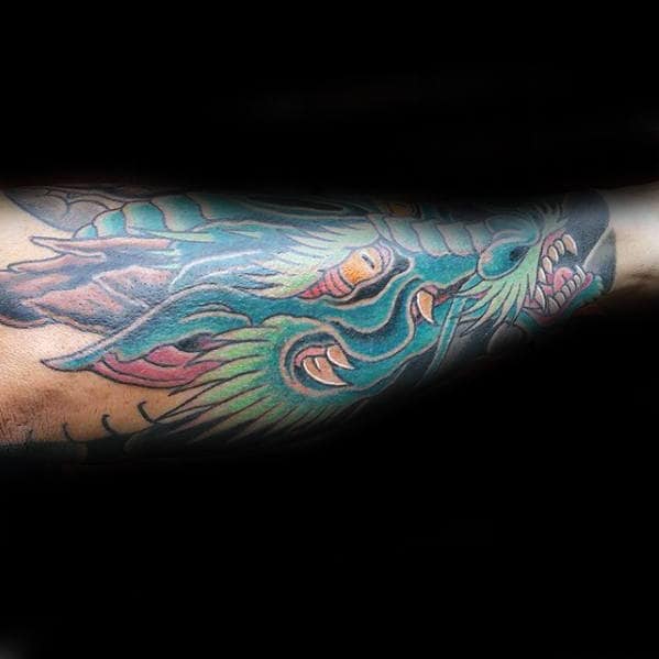 Man With Outer Forearm Dragon Head Tattoo Design