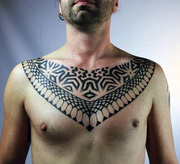 Man With Pattern Tattoo On Chest