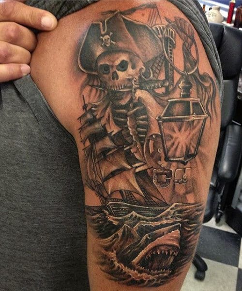 Man With Pirate Life Tattoo On Arm