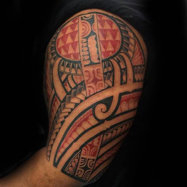 Man With Polynesian Tribal Red And Black Ink Arm Tattoo