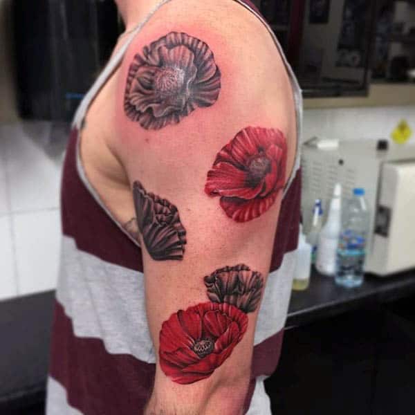 Man With Poppies Tattoo Along Upper Arm