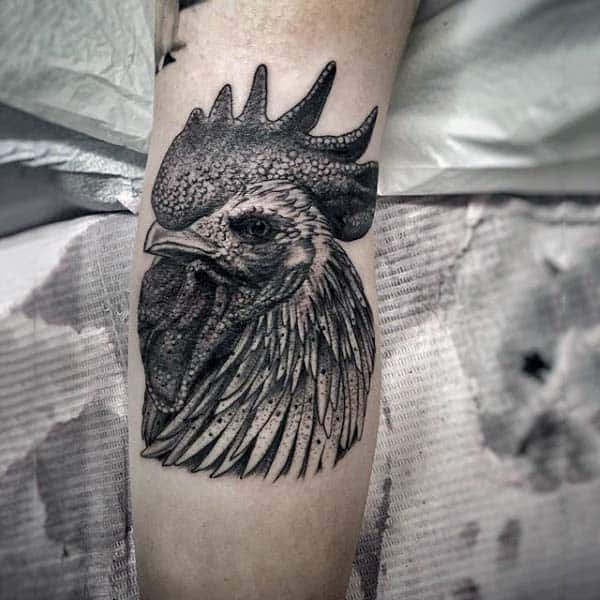 Man With Proud Rooster Tattoo On Forearm In Blackwork