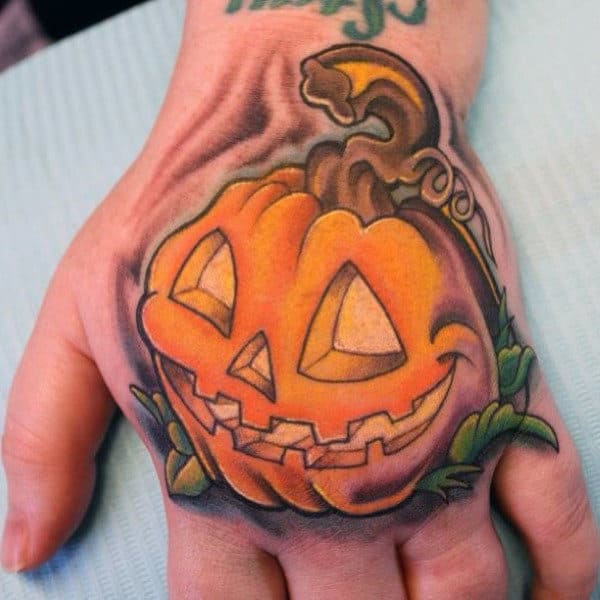 Man With Pumpkin Tattoo On Hand