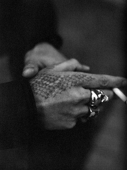 Man With Rattlesnake Skin Hand Tattoo