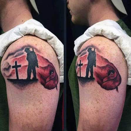 Man With Remembrance Poppy Tattoo On Upper Arm