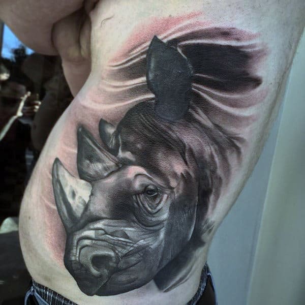 Man With Rhino Grey And Black Ribs Tattoo