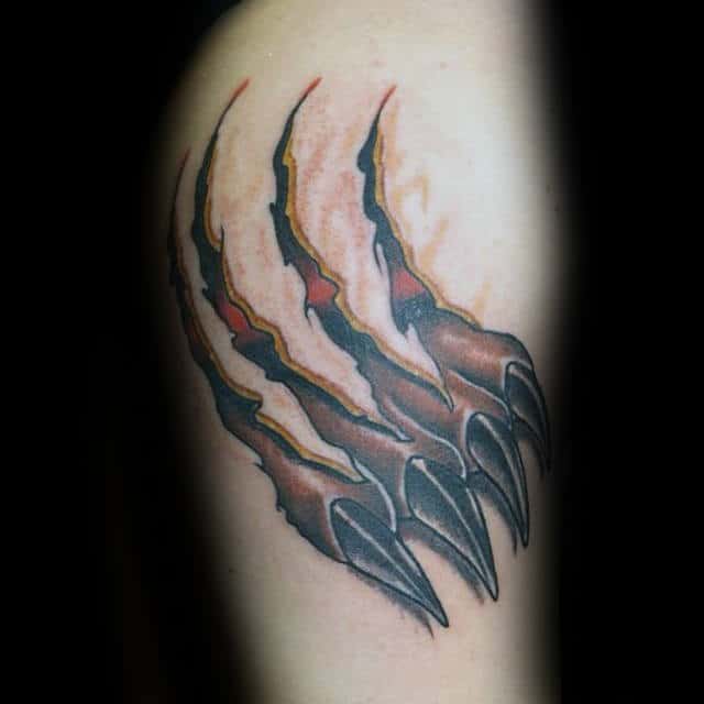 Man With Ripped Skin Bear Claw Tattoos On Arm