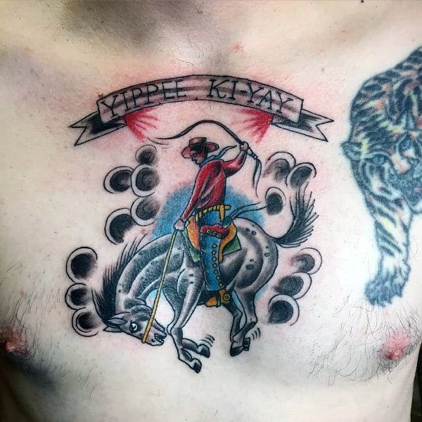Traditional-style tattoo of a cowboy riding a bucking horse, featuring bold outlines, vibrant colors, and a “Yippee Ki-Yay” banner for a Western feel.