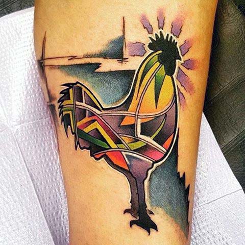 Man With Rooster Tattoo On Calf In Abstract Style