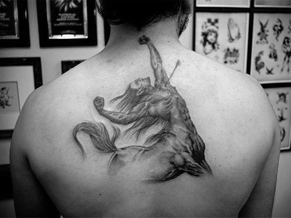 Man With Sagittarius Shot With Arrow Back Tattoo