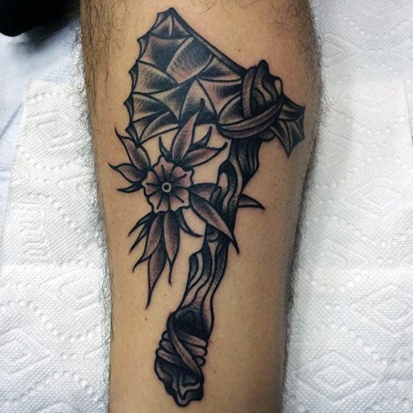 Man With Sailor Jerry Themed Tomahawk Tattoo On Lower Leg