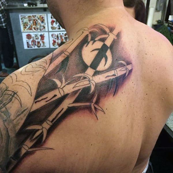 Man With Shaded Bamboo Back Tattoo