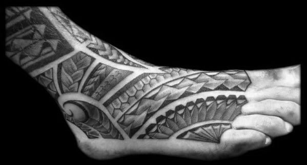 Man With Shaded Black And Grey Polynesian Foot Tattoo