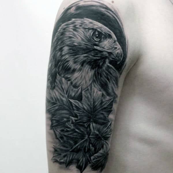 Man With Shaded Hawk Tattoo On Upper Arm