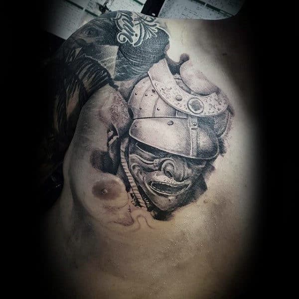 Man With Shaded Samurai Mask Chest Piece Tattoo